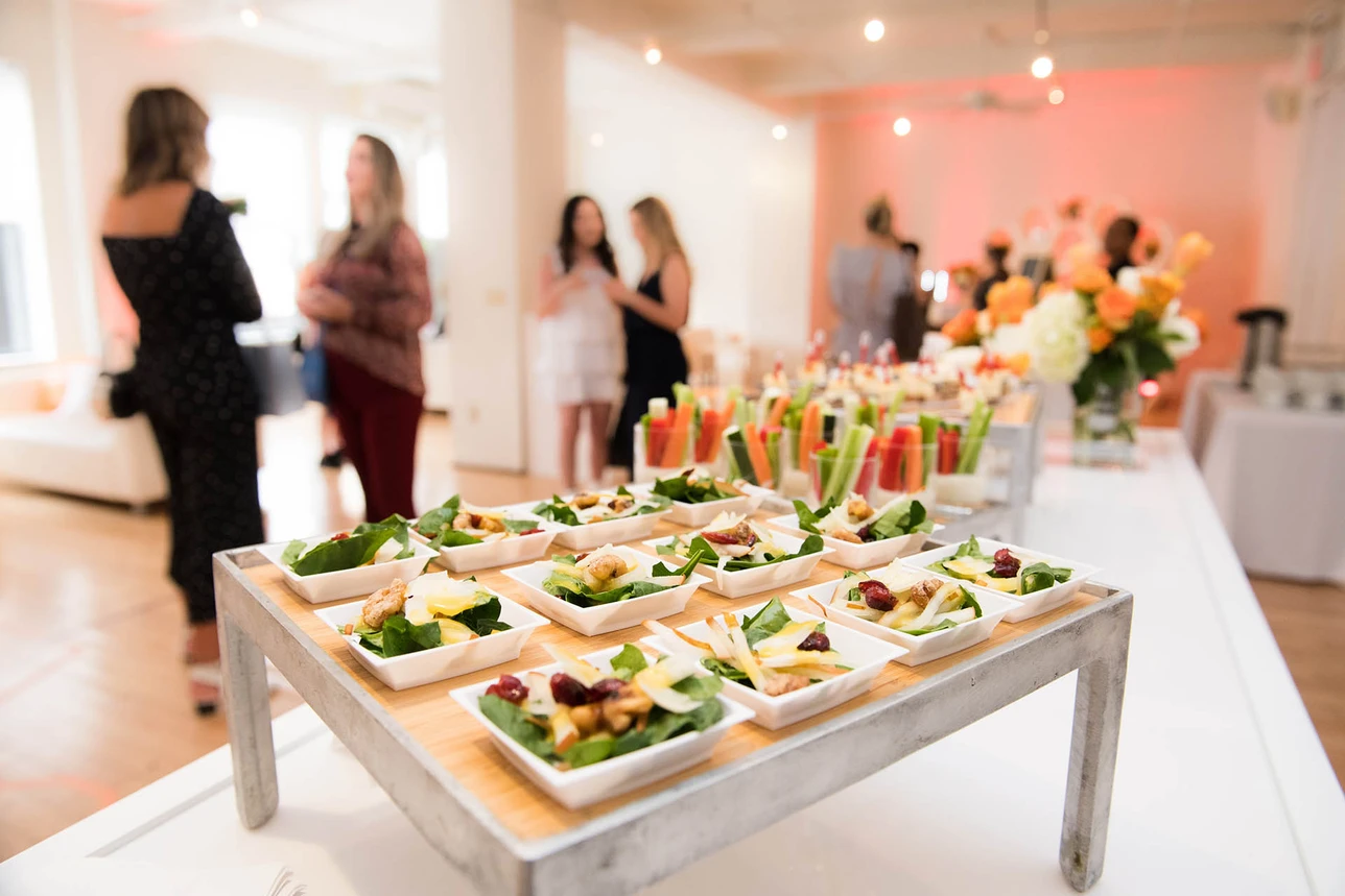 Guests enjoying a catered event with freshly prepared food