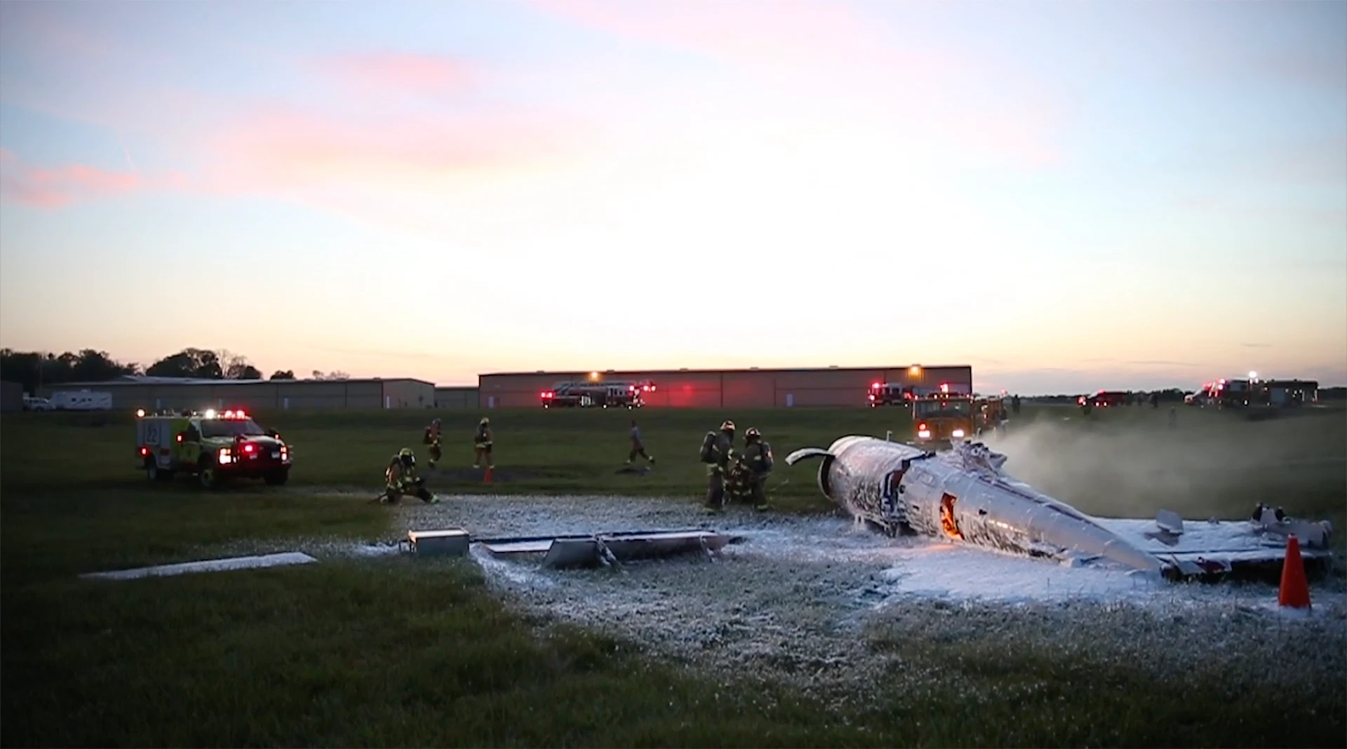 Firefighters responding to an aircraft fire during an emergency training exercise