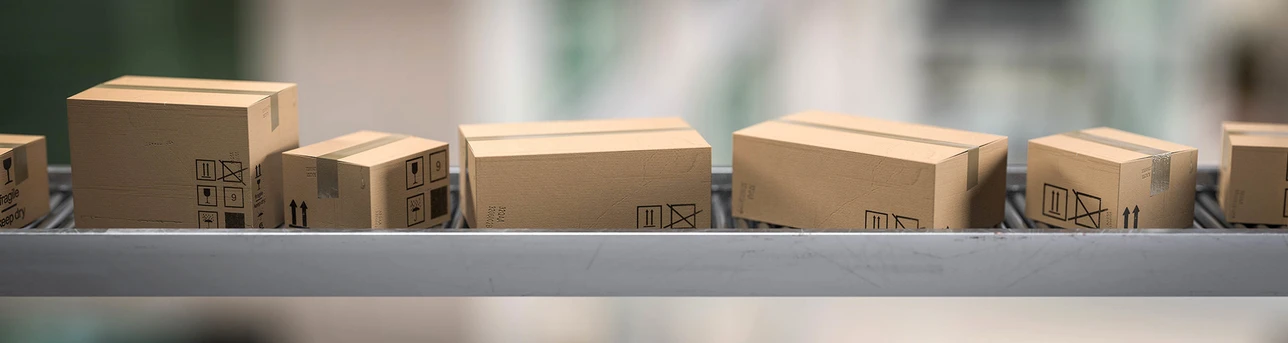 Packages moving along a conveyor belt